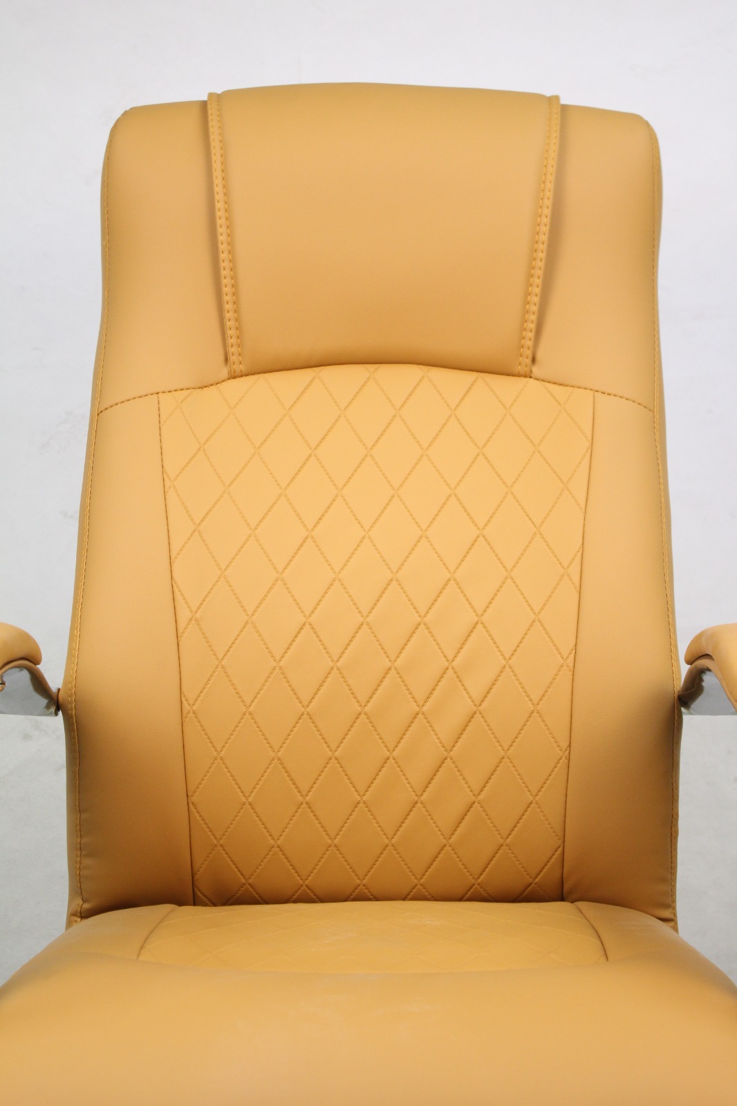 Tan Leather Executive Chair with Diamond Stitching, close-up of the diamond-stitched backrest