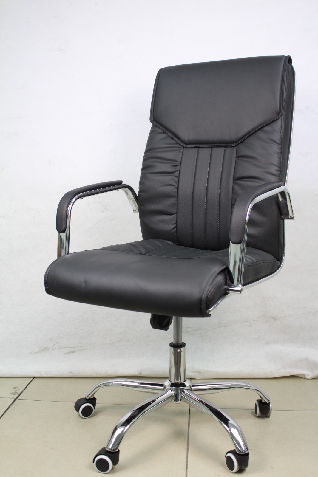 Black Padded Executive Office Chair with Chrome Arms, front angle view