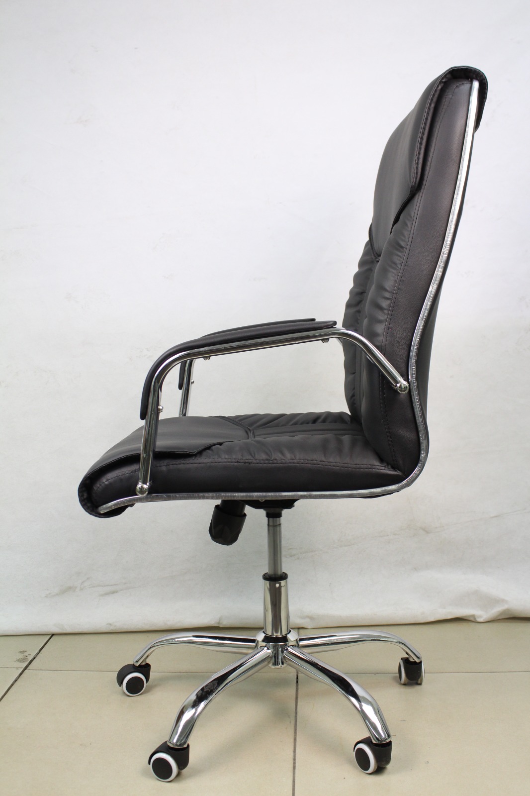 Black Padded Executive Office Chair with Chrome Arms, side view