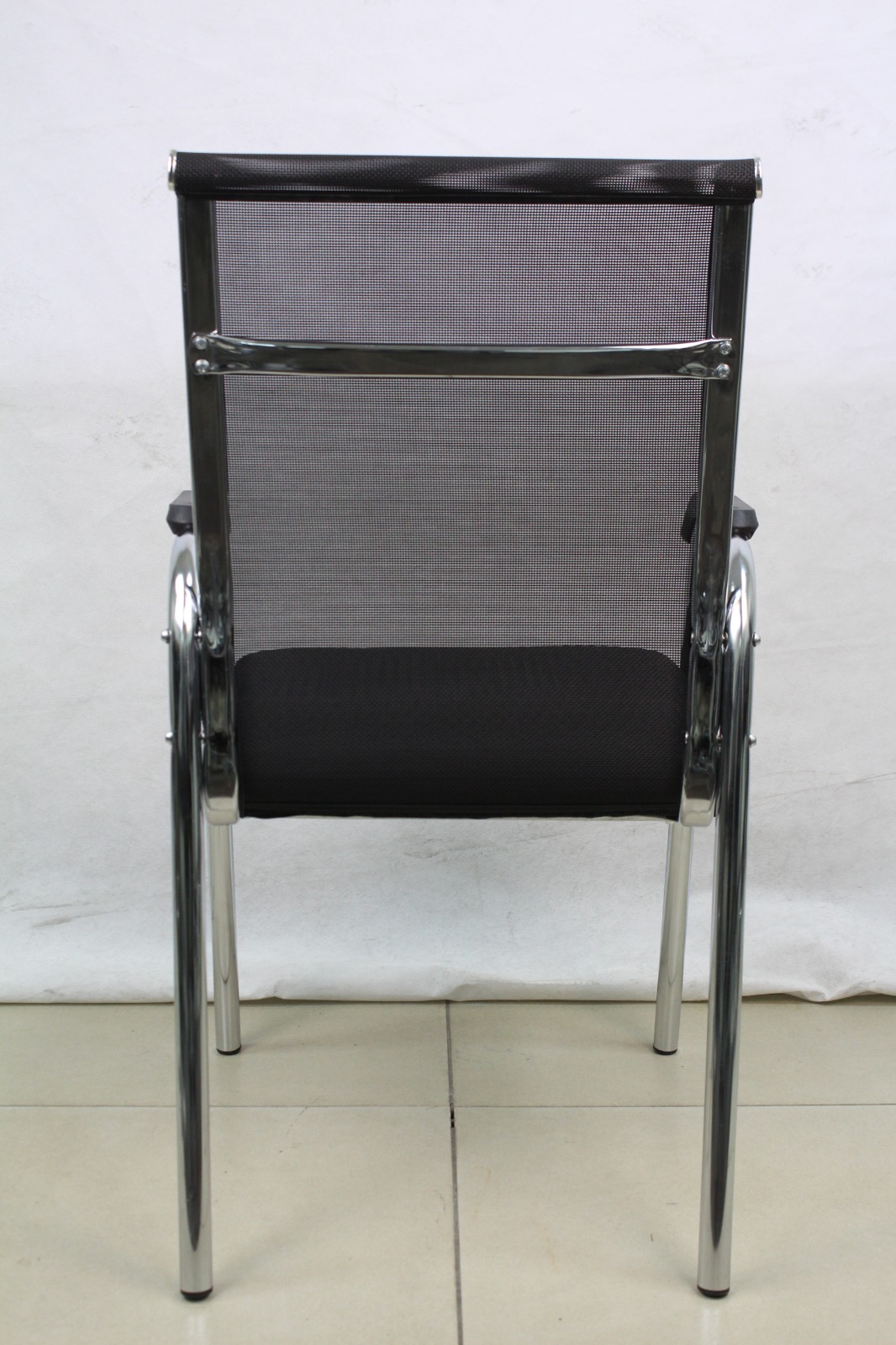 Black Mesh Visitor Chair with Four-Leg Chrome Frame, back view