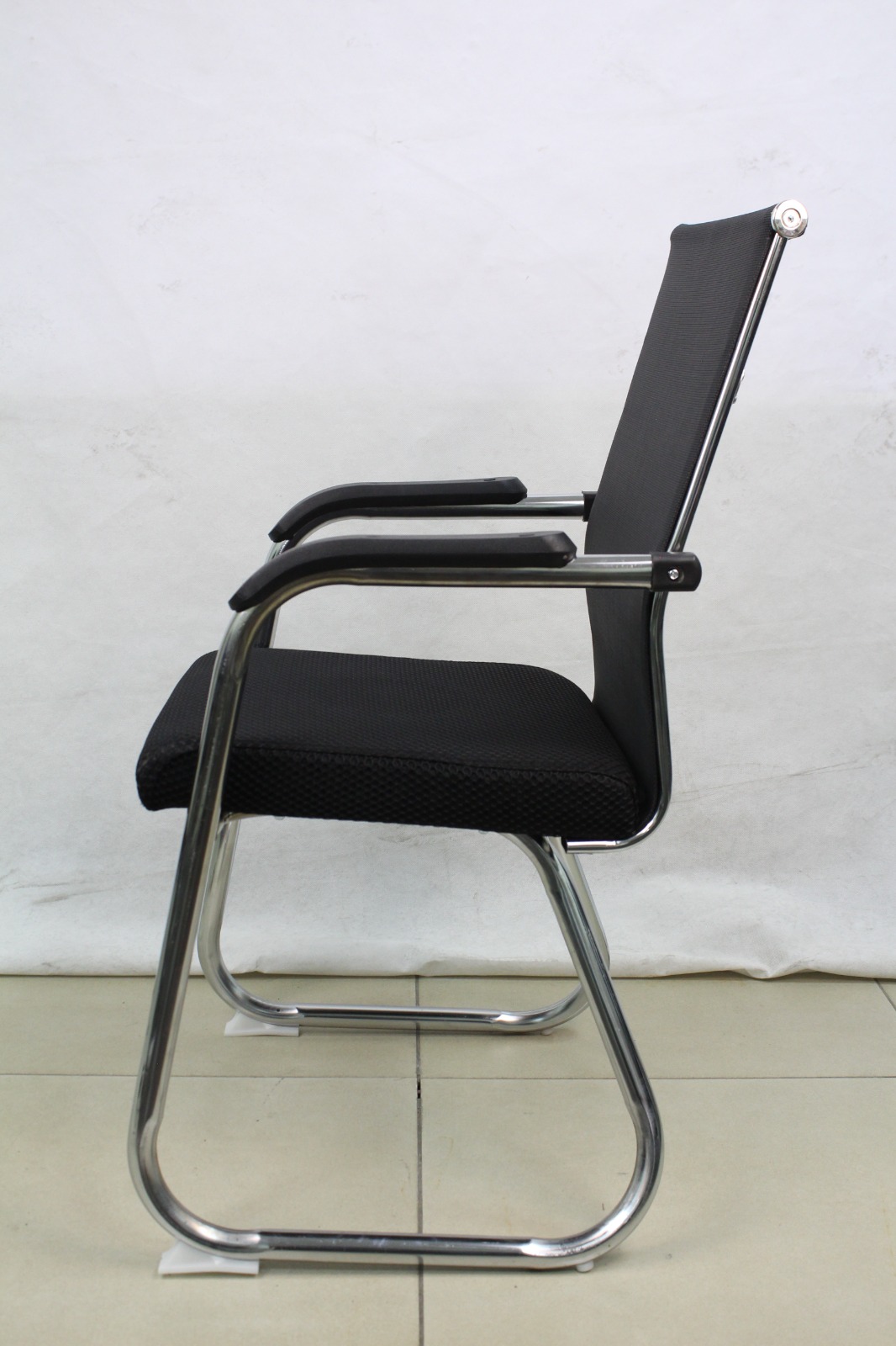 Black Mesh Cantilever Visitor Chair with Chrome Sled Base, side view