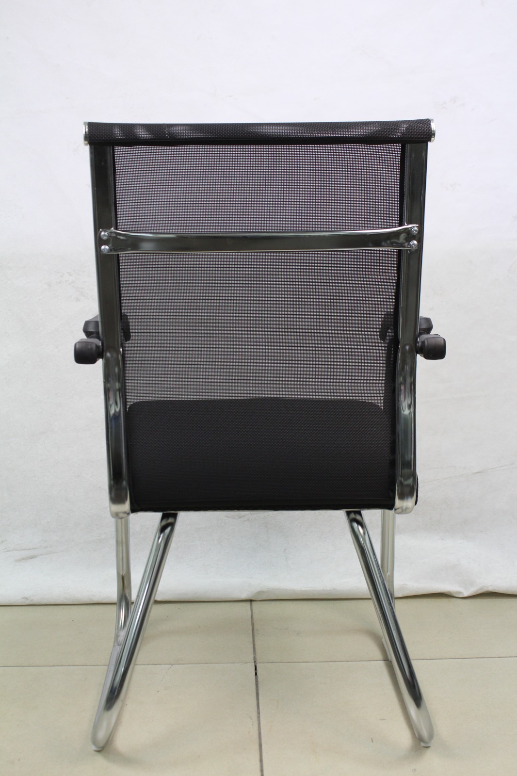 Black Mesh Cantilever Visitor Chair with Chrome Sled Base, back view