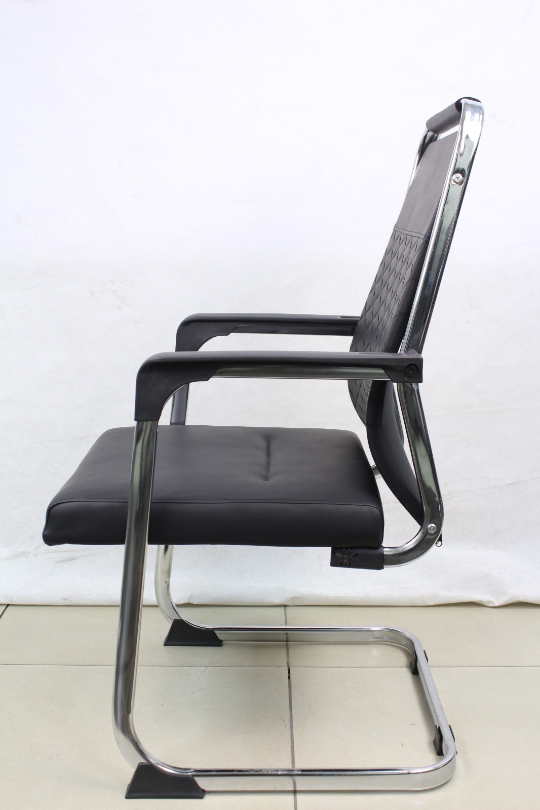Black Diamond Stitch Leather Visitor Chair with Sled Base, side view