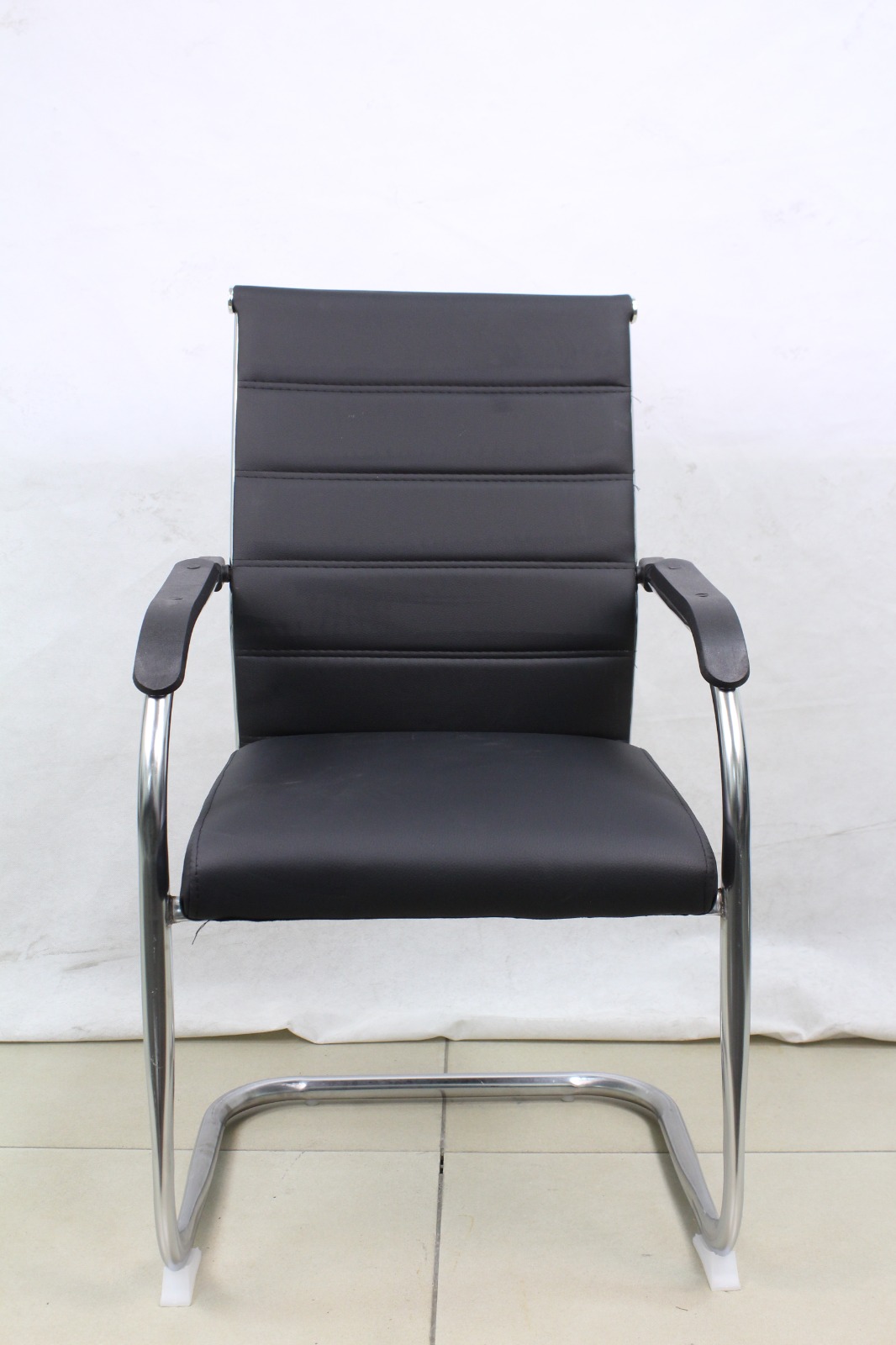 Black Ribbed Leather Cantilever Visitor Chair, front view