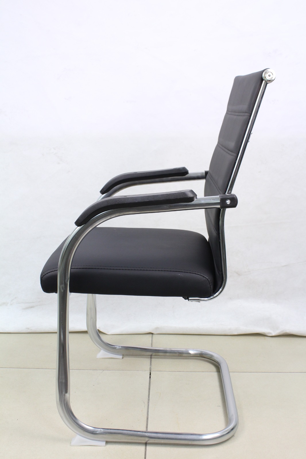 Black Ribbed Leather Cantilever Visitor Chair, side view