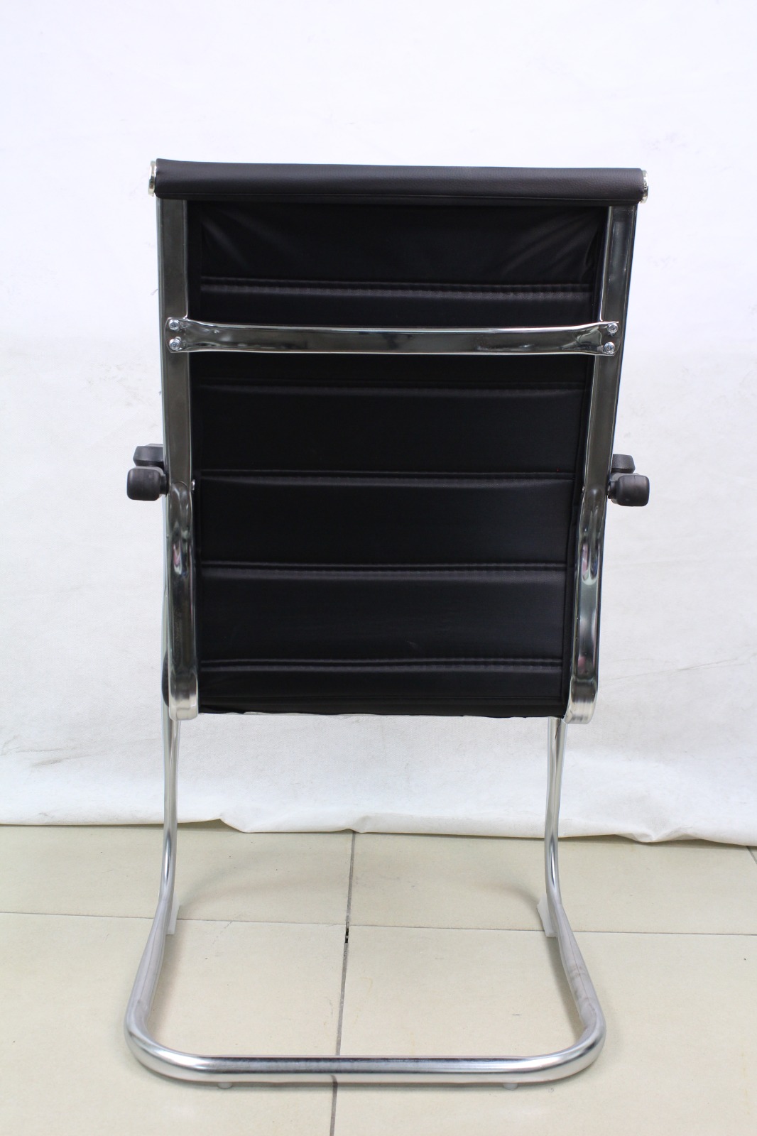 Black Ribbed Leather Cantilever Visitor Chair, back view